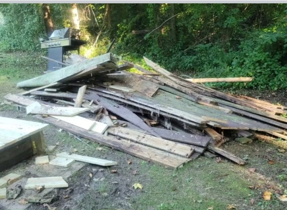Old lumber and exterior debris removed from an Earleville property