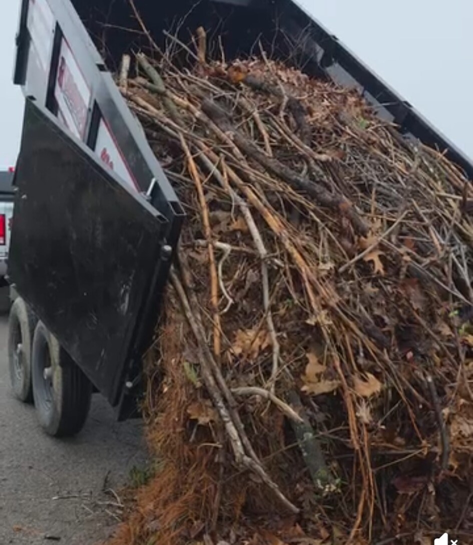 Dump trailer filled with brush removed from a Port Deposit property