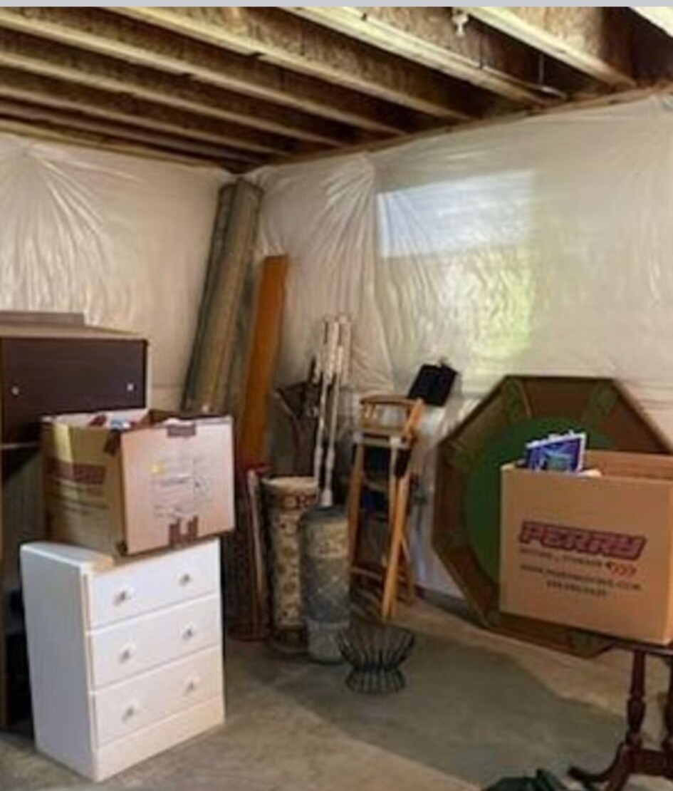 Basement contents being removed from a Rising Sun home